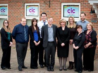 Shaun Gallagher pictured with staff at CIC's Portsmouth Office