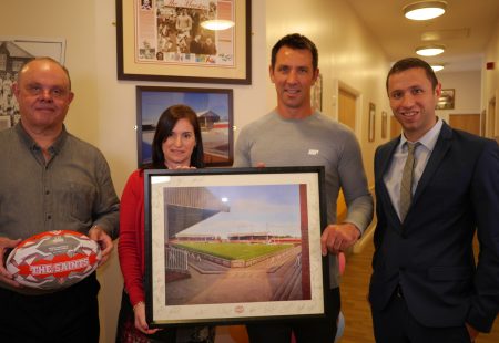 Paul and Eddie present gifts to Community Integrated Care