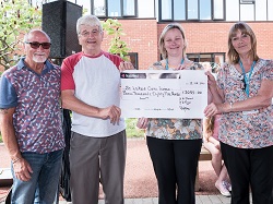 John Timms (second from left) presents St Lukes with 3000 cheque