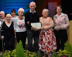 St Catherine's receive their ‘Thriving’ Award for the In Your Neighbourhood category at the Britain in Bloom North West Awards