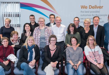 Community Integrated Care's Interim Chief Executive Officer Phil Pegler (centre) with delegates from John Bost Foundation
