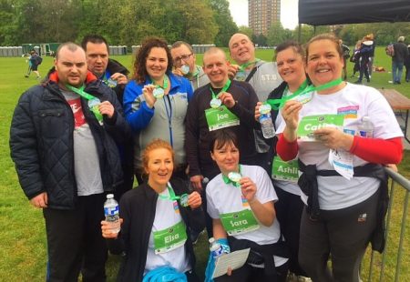 Staff and people supported at Gordon House and St Michaels proudly pose with their medals