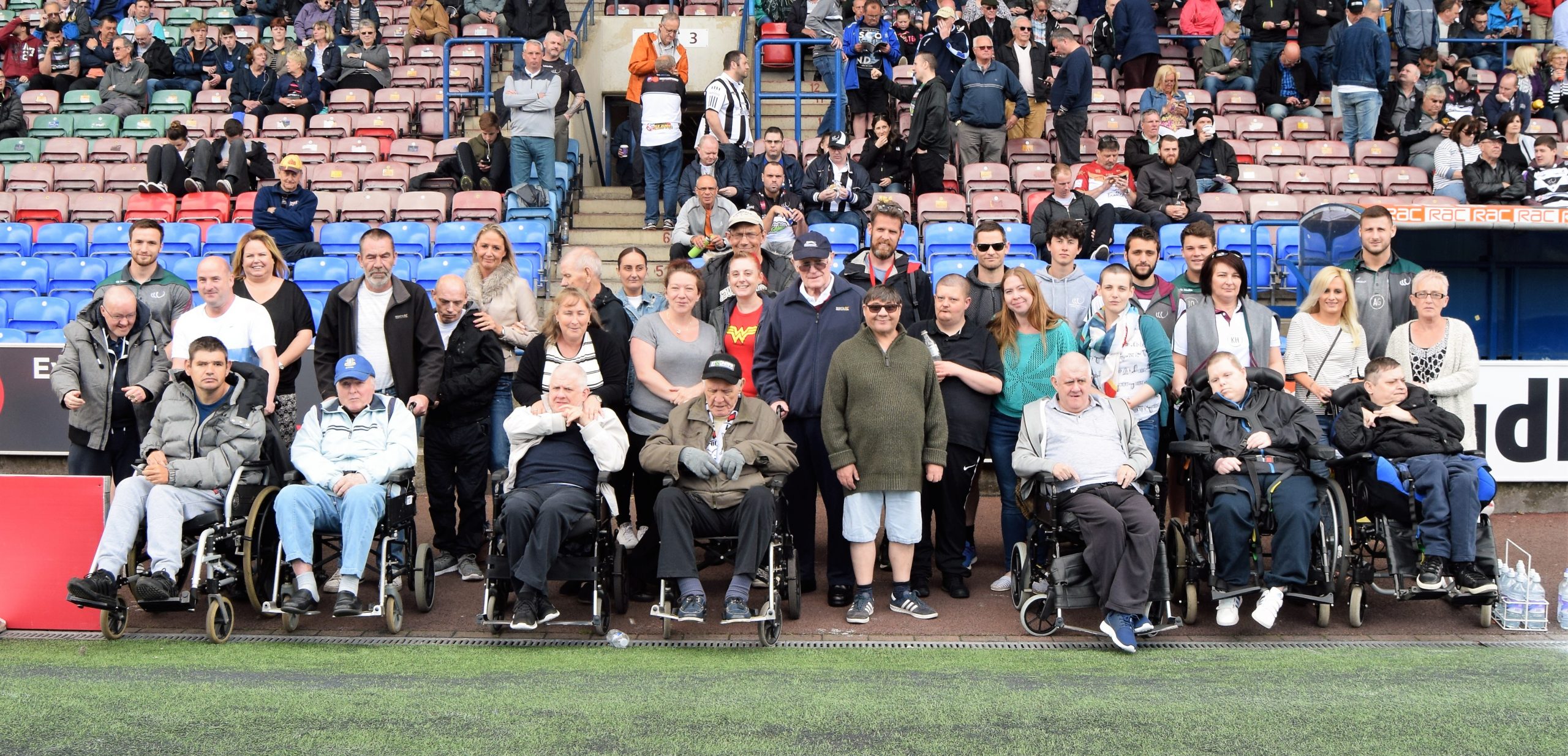 People Supported by Community Integrated Care have their photo taken with Vikings players Alex Gerrard and Joe Mellor
