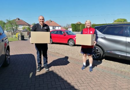 Middlesbrough FC volunteers holding treat boxes