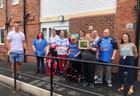 Paul Sculthorpe meeting people we support in St Helens