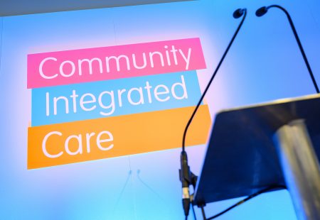 Community Integrated Care logo on stage