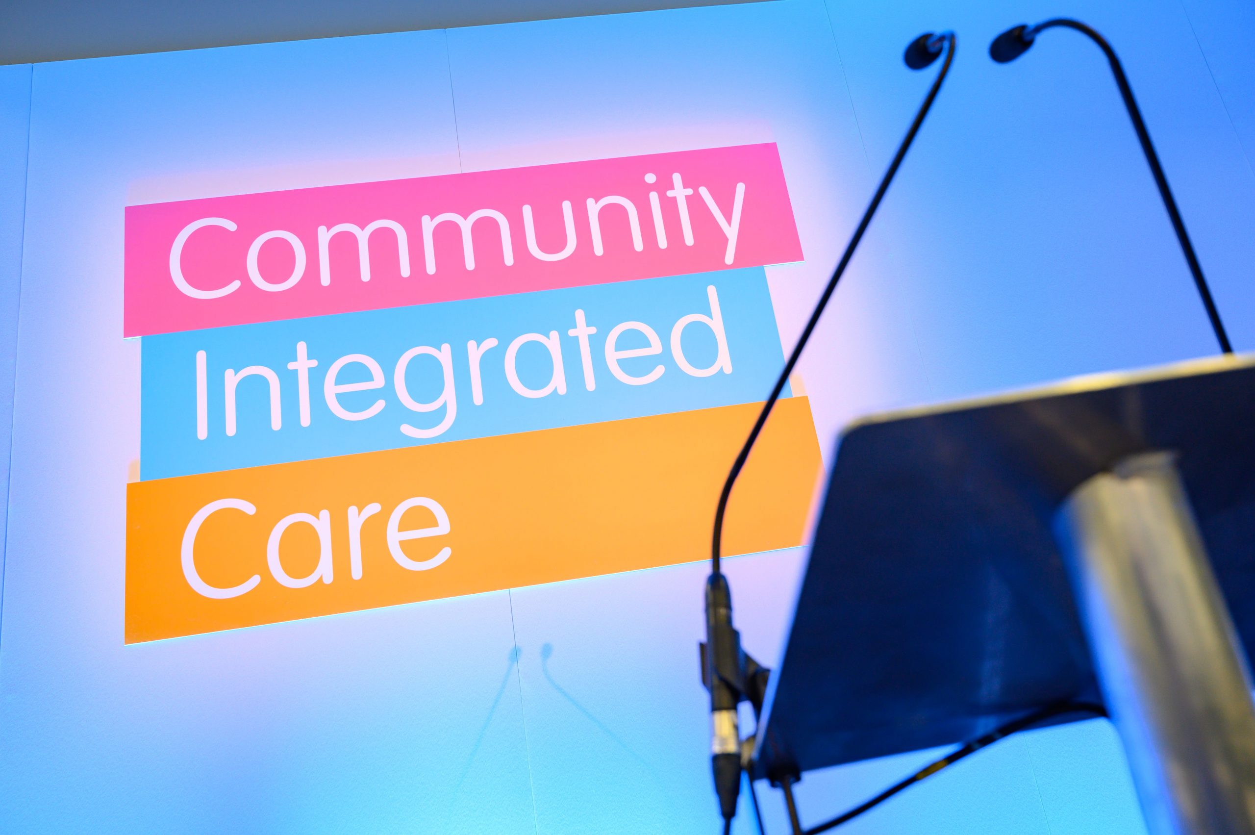 Community Integrated Care logo on stage