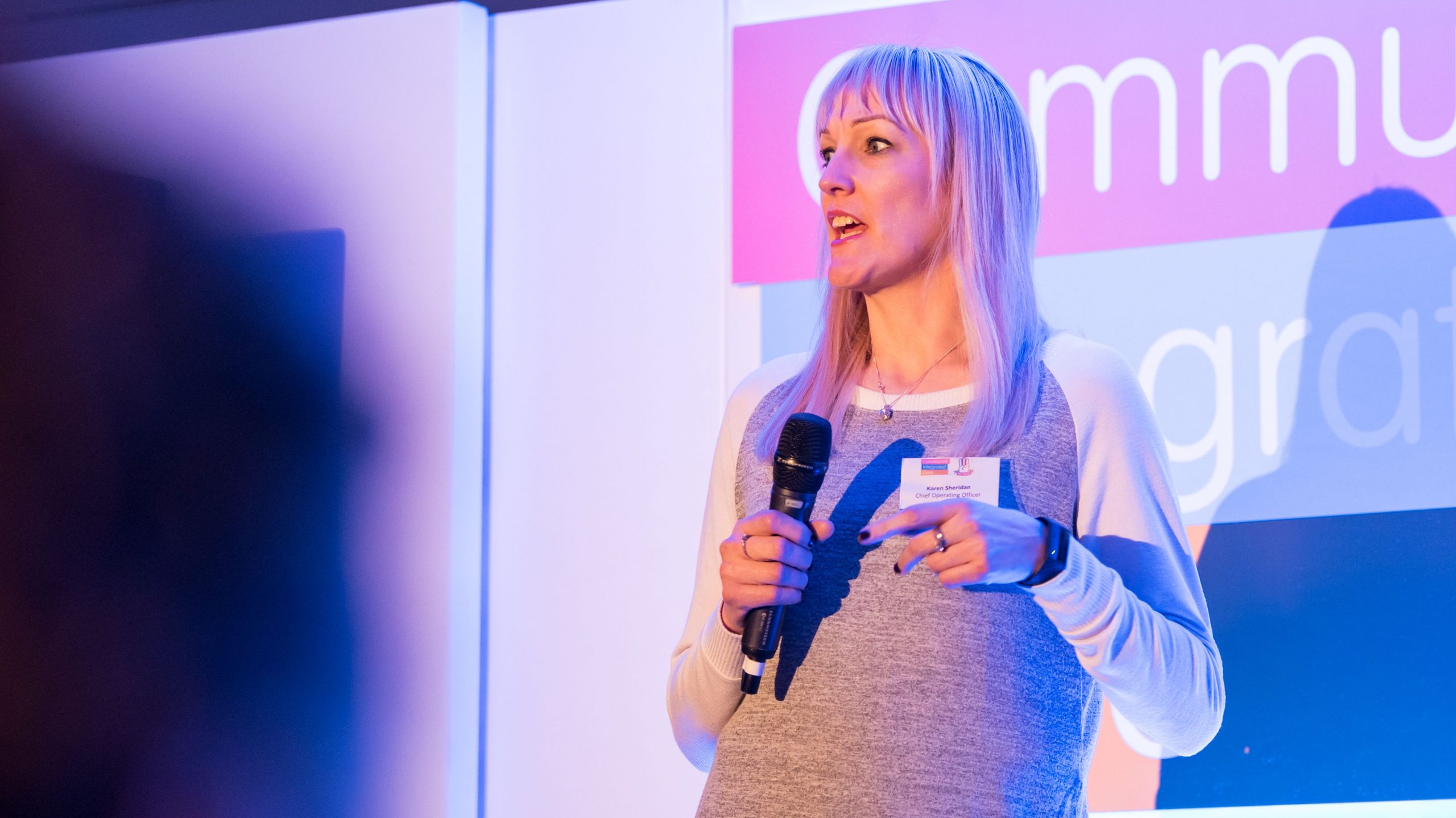 Karen Sheridan speaking on stage at old Trafford roadshow
