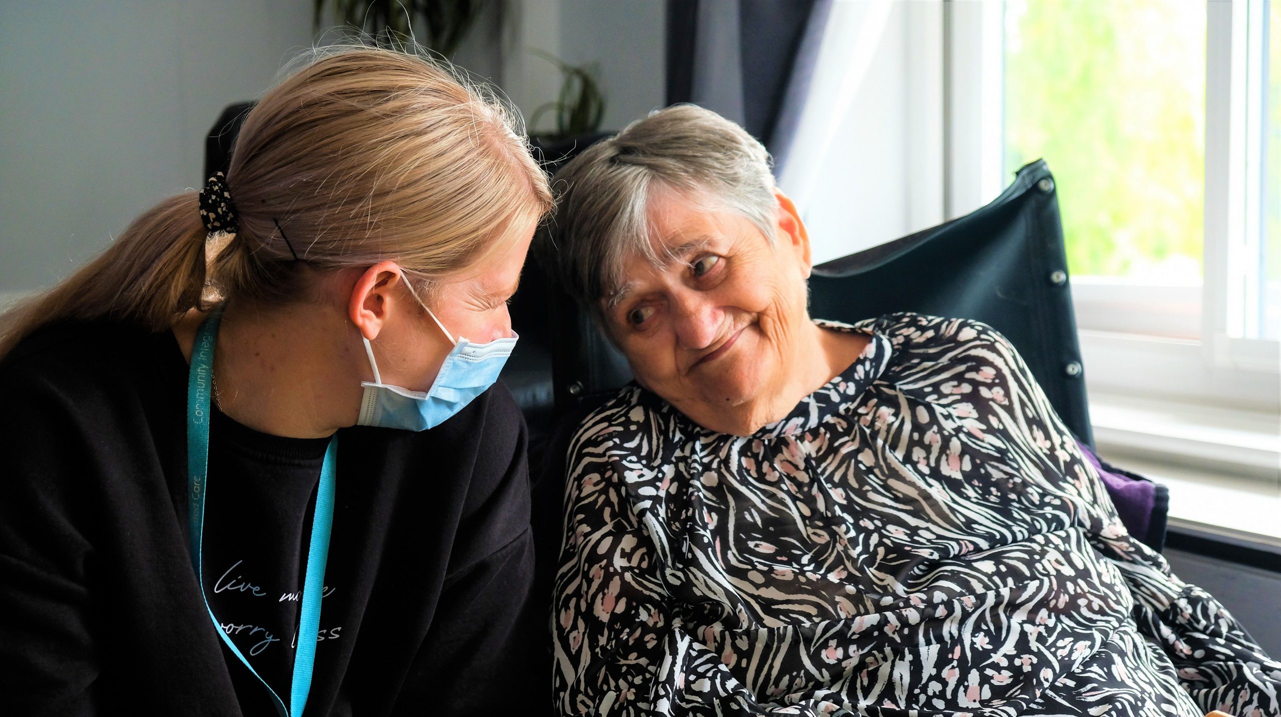 Person we support in wheelchair older person with colleague