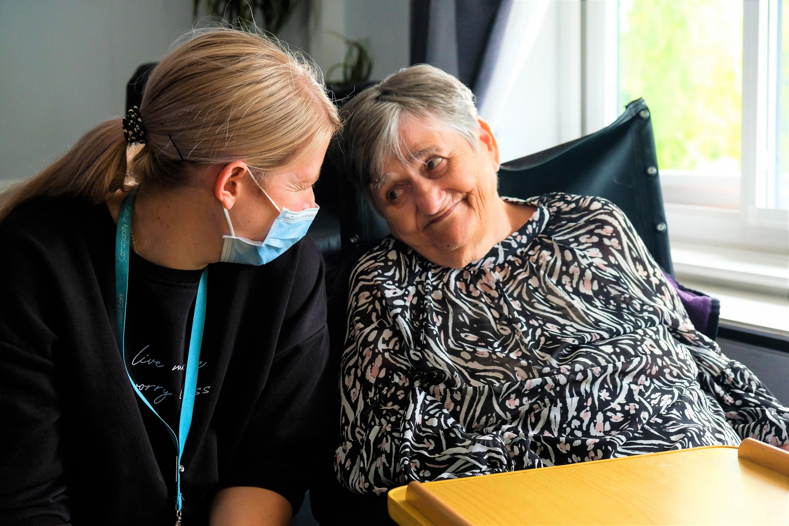 Person we support in wheelchair older person with colleague