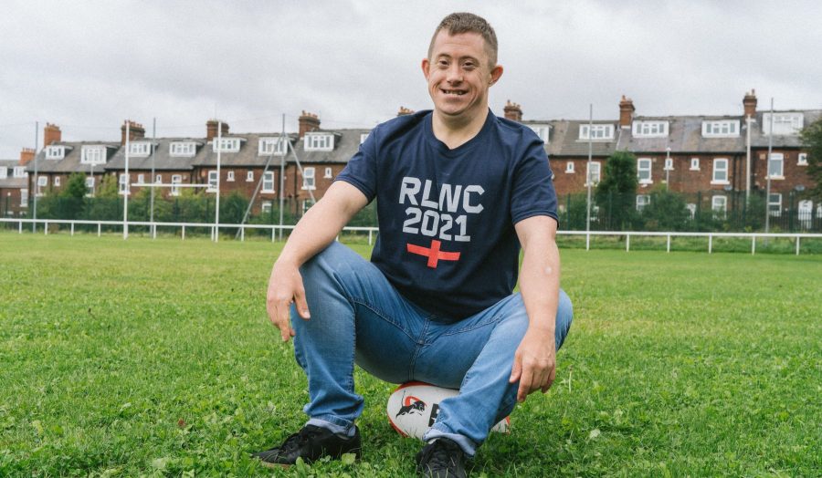 Person we support in RLWC t shirt on rugby ball