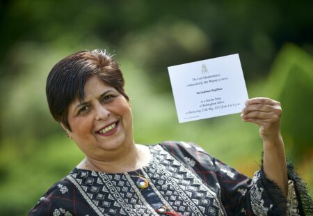 Quality Advisor Sushma hold invitation to royal garden party