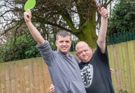 People with care and support needs playing table tennis