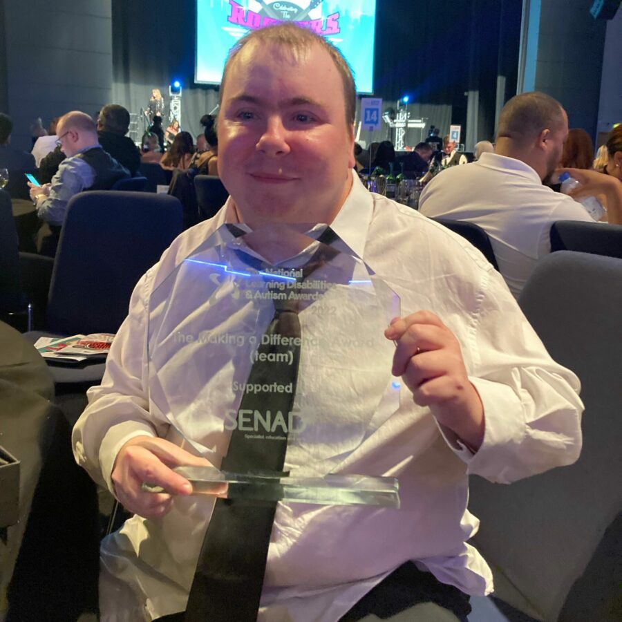Inclusive Volunteer, James Brooks, holds the Making a Difference Award for Community Integrated Care and RLWC 2021.