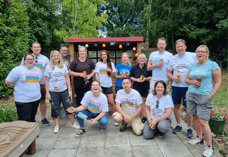 Trustees from the B&Q Foundation join colleagues from Community Integrated Care celebrating the transformation of Linda Grove, in the service's newly decorated garden.