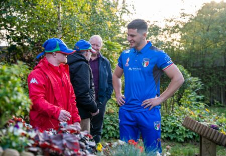 Italy Rugby League team members chat with inclusive volunteers