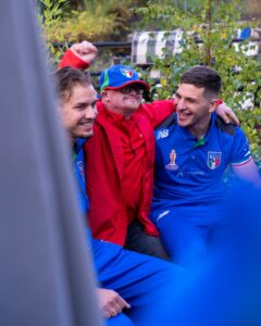 Italy Rugby League team members chat with inclusive volunteers
