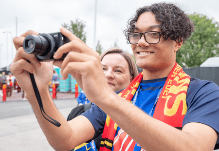 Inclusive volunteer taking a photo.