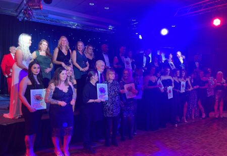Colleagues pose with their trophies and certificates at the Great British Care Awards