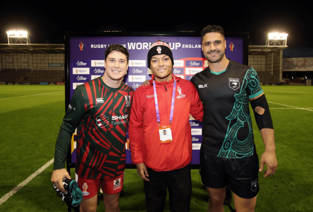 Inclusive Volunteer stands with RLWC 21 players
