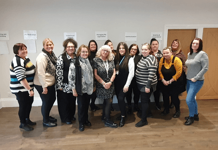 Group of Service Leaders stood smiling at the camera