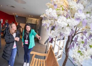 two colleagues look at the Tree of Reflection 