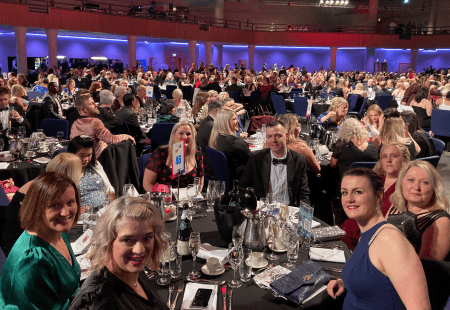 Colleagues sit around a table at the GB Care Awards Finals