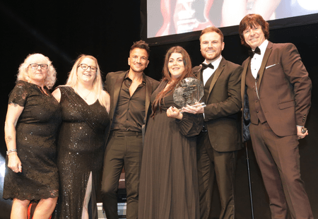 The team at Kirkdale House stood with Peter Andre and the GB Care Awards host, collecting their award for Housing with Care champions.