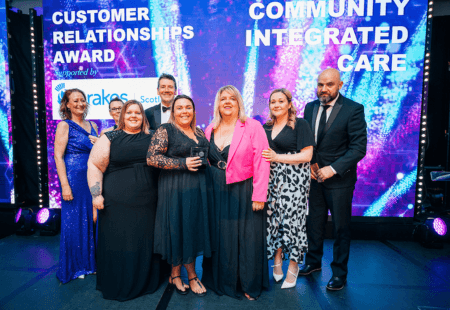 Clare and the team collecting their award at the Scotland Excel Supplier Excellence Awards