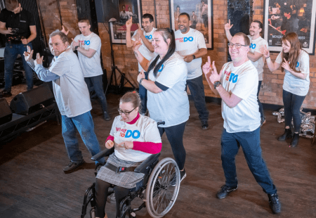 People dancing and celebrating the relaunch of What To Do