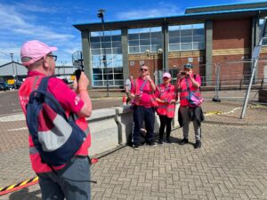 Inclusive volunteers posing for a photo at Tall Ships Event