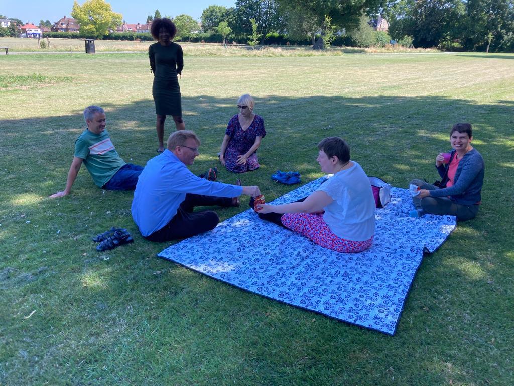 Trustees join people we support for a summer picnic.