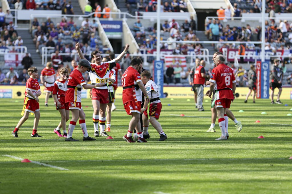 Members of the LDSL playing on the pitch