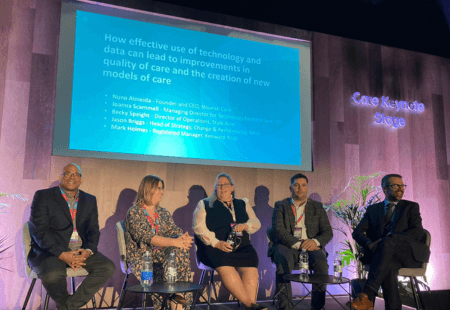 Joanna Scammell, Community Integrated Care's Managing Director for TEC sits onstage at the Care Show with four other panelists.