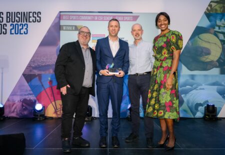 Accepting award from Sports Business Award ceremony hosts for Inclusive Volunteering Programme