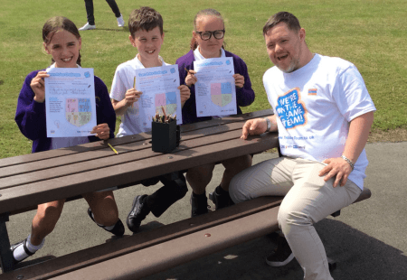 Oliver Thomason, Community Integrated Care's Sports Inclusion Coordinator, educates a group of primary school children on anti-bullying as part of On The Same Team.