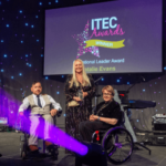 Natalie Evans (centre) with awards presenters, Rich Amos (left) and Baroness Tanni Grey-Thompson (right).