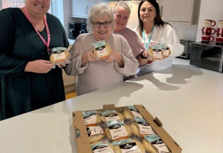 3 ladies taking a photo and holding Cottoms' pies
