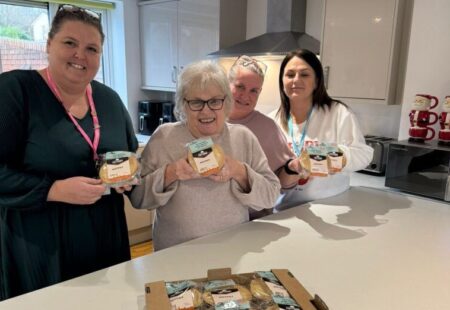 3 ladies taking a photo and holding Cottoms' pies