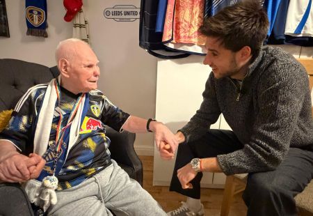 Ilia speaking to Barry, a person we support. Both are smiling.