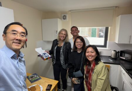 Three people from SG Enable, stood with two Community Integrated Care colleagues.