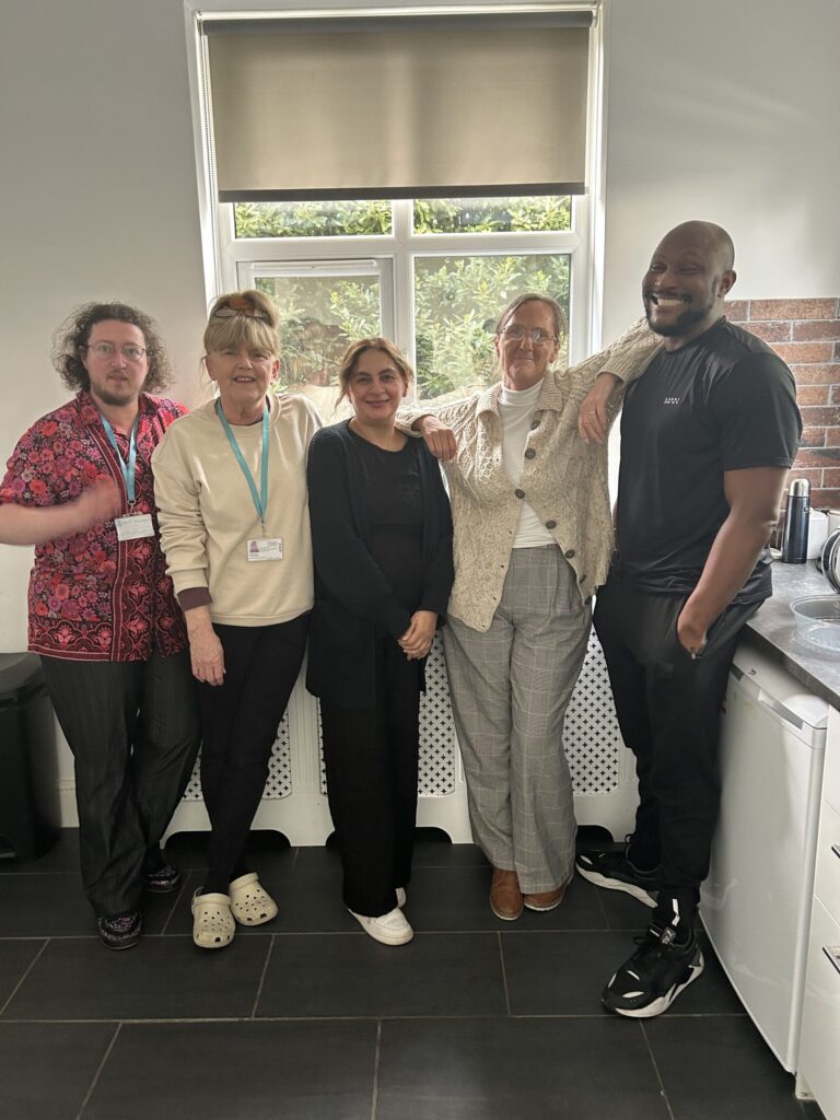 Five membersof the Brackley House team stand together smiling to camera.