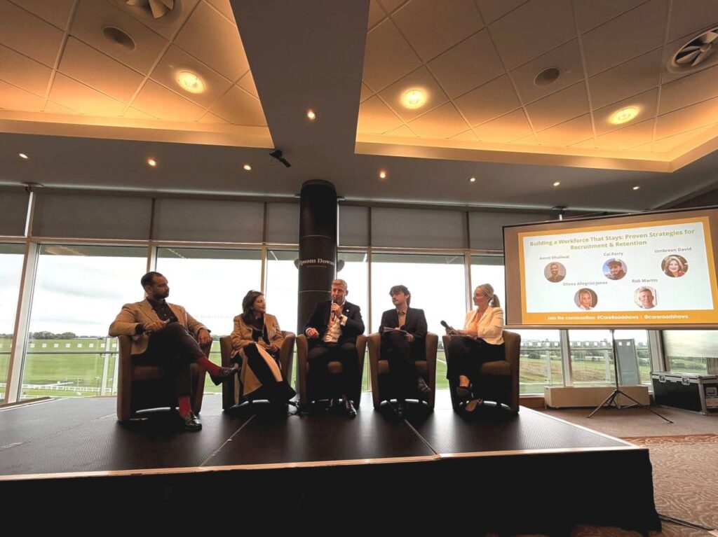 Five panellists sit onstage for the Care Roadshows South
